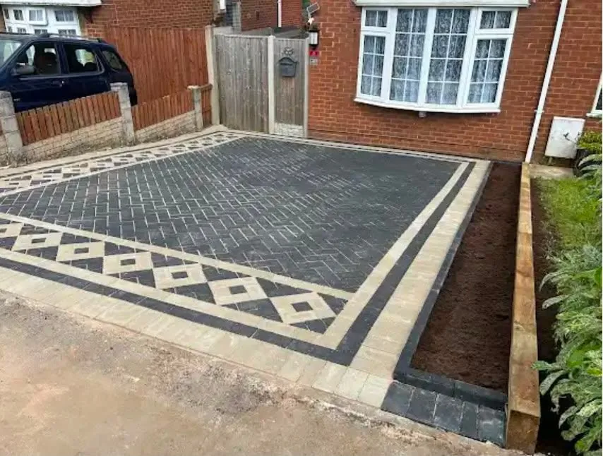 Block paved driveway with a patterned border
