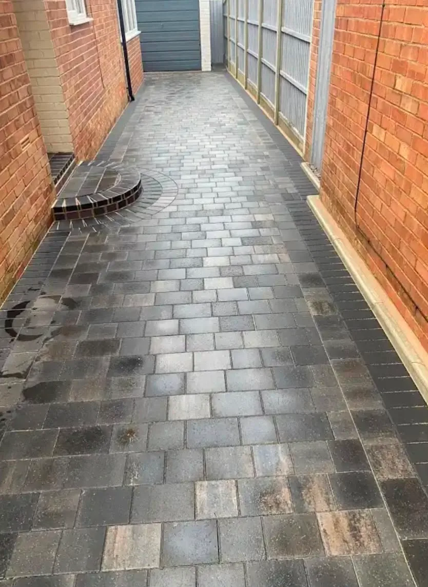 Block paved driveway with a curved step