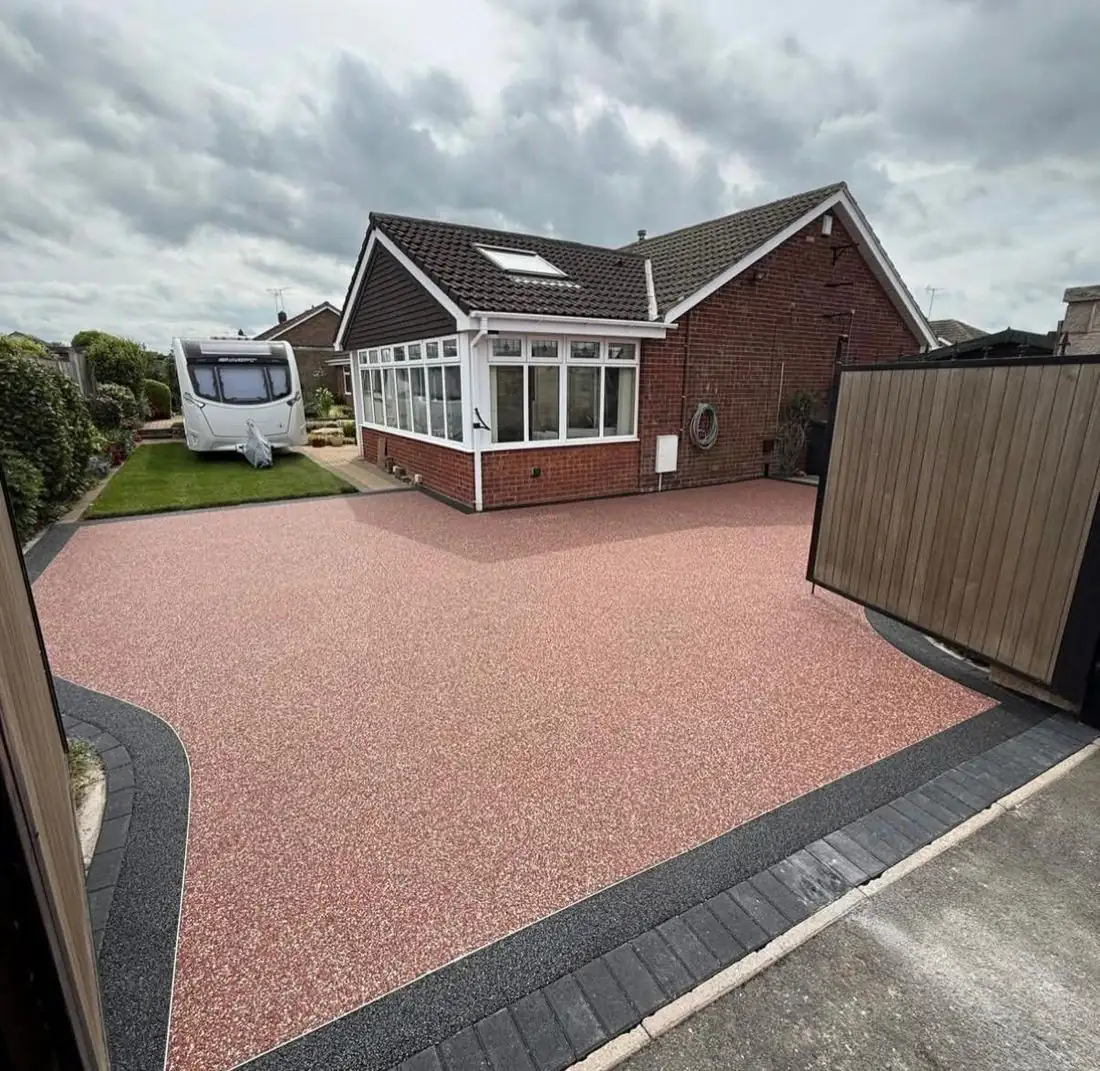Red resin bound driveway at a bungalow