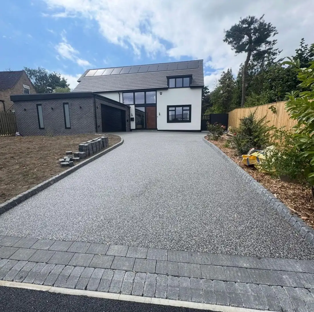 Grey resin bound driveway at a modern house
